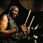 Baqueta Promark Signature Elvin Jones TXJZW "Padrão 7A" mais Comprido (020433)
